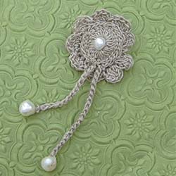 beige and white pearl crochet brooch